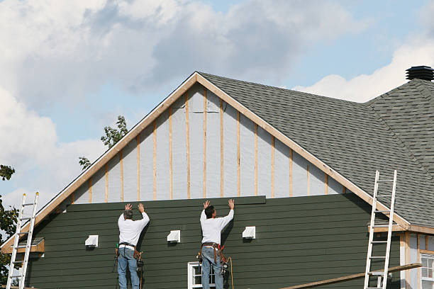 Professional Siding Contractor technician working in Spring Valley, NY